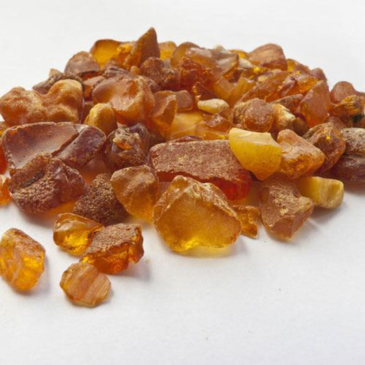 Amber stones on a white surface 